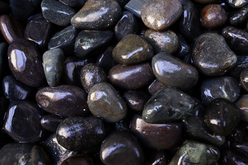 Batu hitam. Sea stones background.