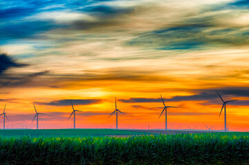 Fototapeta na wymiar Wind turbines earlyin early dawn light