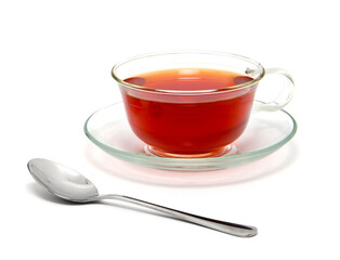 Glass cup of hot aromatic tea on white background