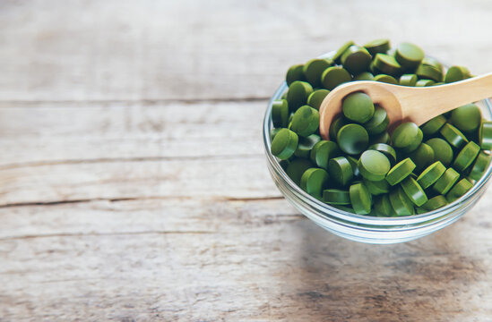 There Are Many Spirulina And Chlorella Tablets. Selective Focus.