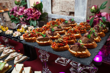 Сatering. Banquet table with different snacks and desserts