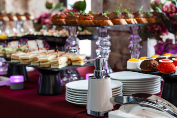 Coronavirus covid-19 pandemic. Healthcare concept. Hand sanitizer bottle on table  in a restaurant or banquet table