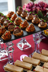Сatering. Banquet table with different snacks and desserts
