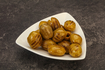 Green grilled olives in the bowl