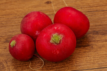 Ripe fresh radish heap over wooden
