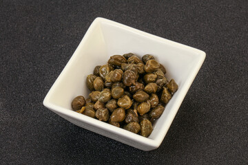 Tasty capers in the bowl