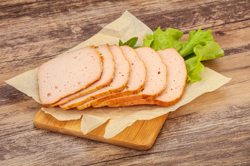 Boiled pork sausage over board