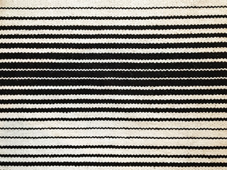 Seamless close up black and white carpet texture background from above. decoration interior element of room.