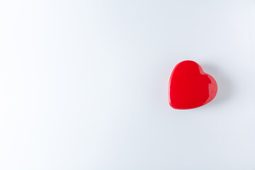 lonely red heart on white background. - health care, love, organ donation, mindfulness, wellbeing, concept. - world heart day, world health day, National Organ Donor Day.
