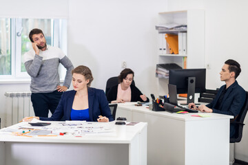 Office workers busy with their tasks, daily office routine.