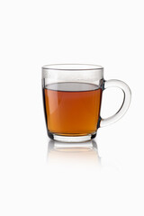 Tea in a transparent glass mug on a white background