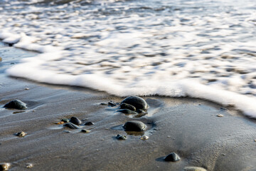 Fototapeta na wymiar Waves and rocks on a beach on Vancouver Island, BC Canada