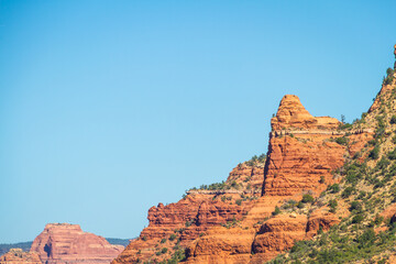 The red rock cliff faces of Sedona Arizona with a bright blue sky.