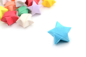 blue origami star on white