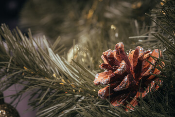 Christmas tree holidays decoration of red and gold balls with pinecones