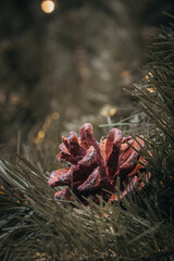 Christmas tree holidays decoration of red and gold balls with pinecones
