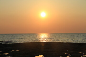 sunset time in livorno city beach