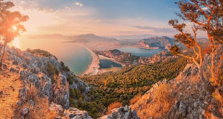Stunning panoramic view from the top of the mountain to the blue bay and lagoon near the town of Dalyan in Turkey. Famous Mediterranean resorts and the wonders of nature - obrazy, fototapety, plakaty