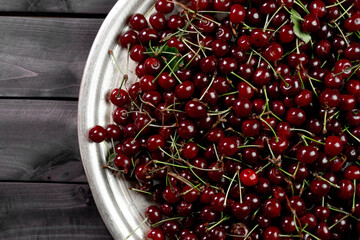 Ripe cherries on wooden background