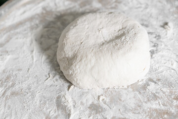 Fototapeta na wymiar Dough pieces in flour For further baking