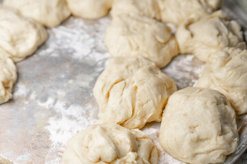 Dough pieces in flour for baking
