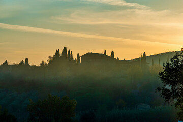 sunset over the Chianti hills of Siena in Tuscany in autumn