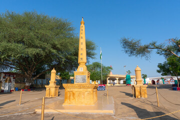 Obraz premium Jaisalmer, Rajasthan, India - 15th October 2019 : Memorials at Tanot Mata Mandir at India Pakistan border in Thar desert. Ancient temple maintained by Indian soldiers to worship famous Goddess Tanot.