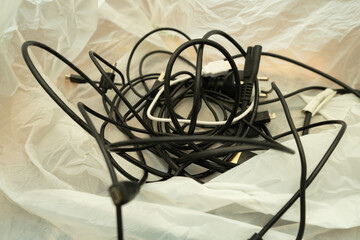 Tangled wires and cords for charging and re-washing devices. Keeping cables.