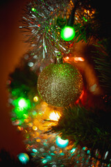 Blurred christmas background.  Defocused texture of Christmas tree decorations. Bokeh from garland lights.