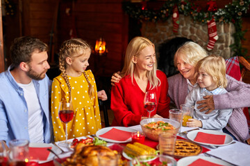 family celebrating christmas eve with traditional food and decoration, preparing turkey for dinner, new year and xmas concept