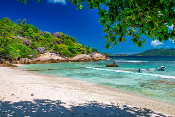 LA DIGUE, SEYCHELLES - SEPTEMBER 12, 2017: Boats anchored near a famous beach in La Digue