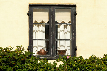 Old Window with Flowers and Copper Kettles
