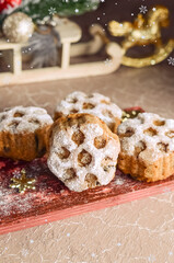 Christmas baking cupcakes with snowflake pattern with Christmas decor.