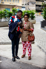 portrait of a beautiful smiling couple with mobile phone