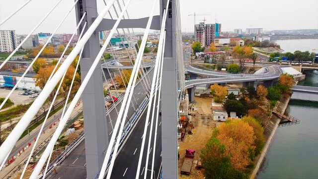 Ciurel passage, bridge over a river with moving cars, construction works near it. View from the drone. Bucharest, Romania