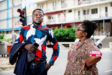 businessman and businesswoman talking on the street