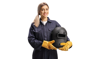 Female welder in a uniform holding a protective helmet