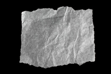 Torn paper isolated on black background.