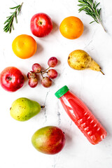 sweet drink in plastic bottles on white background top view