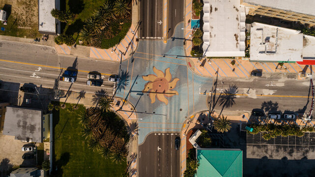 "Daytona Beach, FL USA - 12-10-2020: Top-down drone shot of the iconic sun murals at the International Speedway intersection in Daytona Beach."