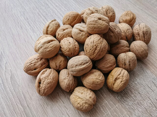 Whole walnuts on a wooden table