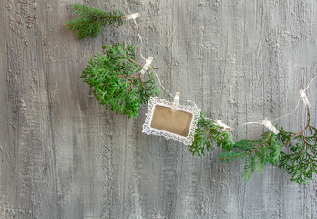 beautiful christmas decor in silvery tones, Christmas tree branches, christmas greeting card on a...
