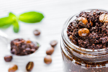 Spa concept with natural coffee scrub on wooden table background
