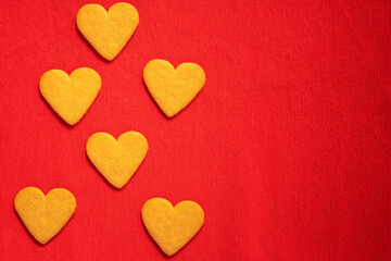 Happy valentine's day, heart shaped gingerbread cookie on red background