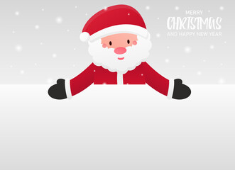 Santa Claus peeps out from behind a blank white background and points with two hands at him. Blank space for your holiday text. Cold and snowy winter. Merry Christmas and a Happy New Year. Banner.