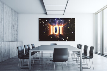 Creative IOT hologram on presentation monitor in a modern boardroom, internet of things concept. 3D Rendering