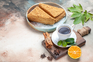 front view tasty honey cake with cup of tea on light background sweet cake pie biscuit