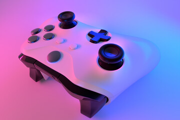 Realistic video game controller in neon lights on white table background © Vasyl Onyskiv