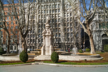 Monumental fountain of Madrid dedicated to the God Apollo and with allegories of the four seasons