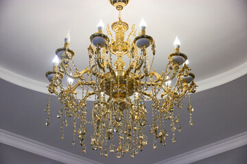 stylish chandelier with gilding, crystal pendants and led lamps